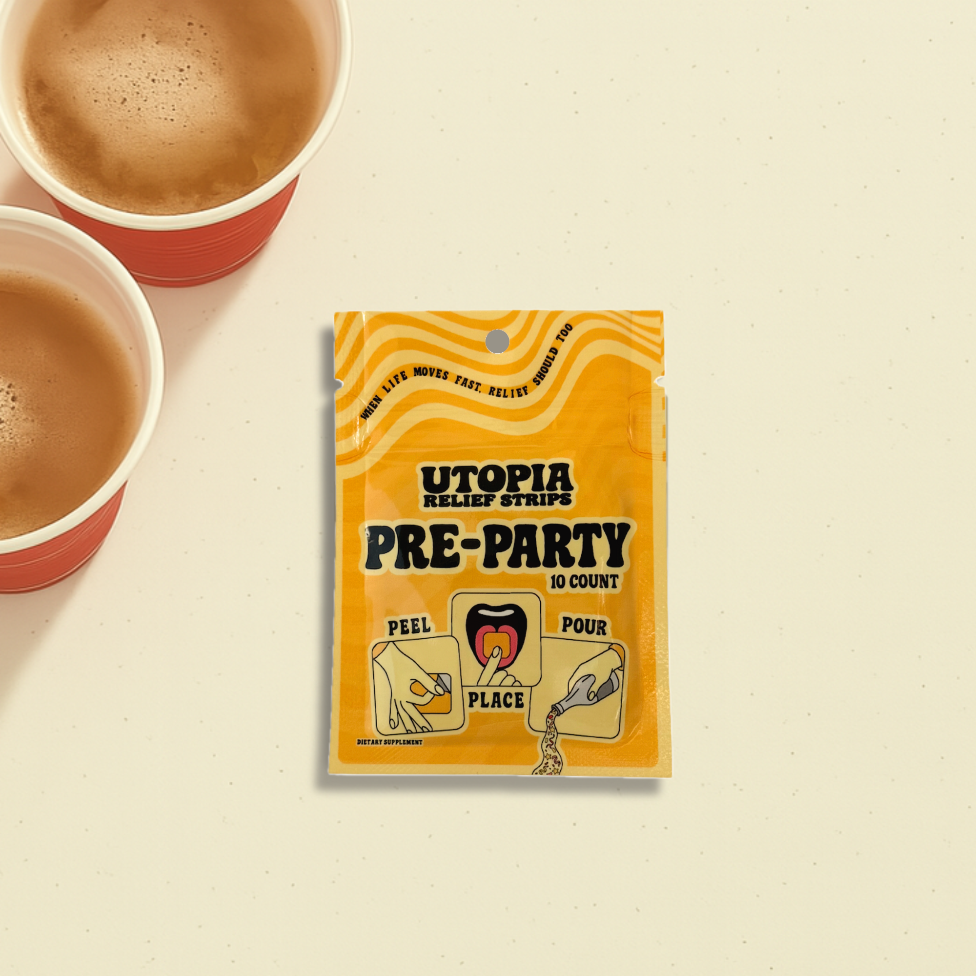 Utopia Pre-Party relief strips packaging with two cups of beer on a beige background at a party