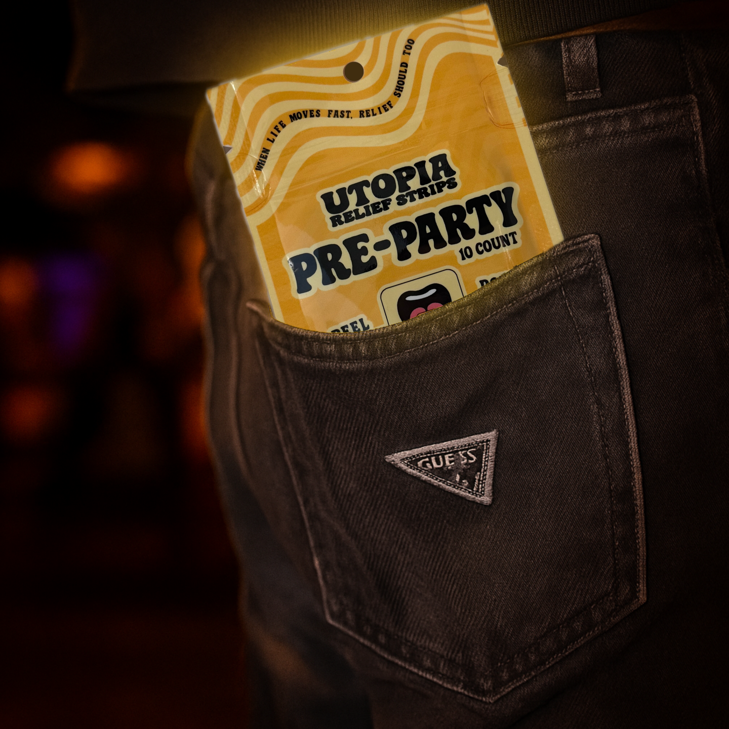 Pouch labeled 'Utopia Pre-Party' in a pocket with a blurred background